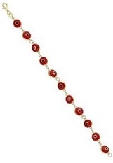 nice little yellow gold red eye childrens bracelet 